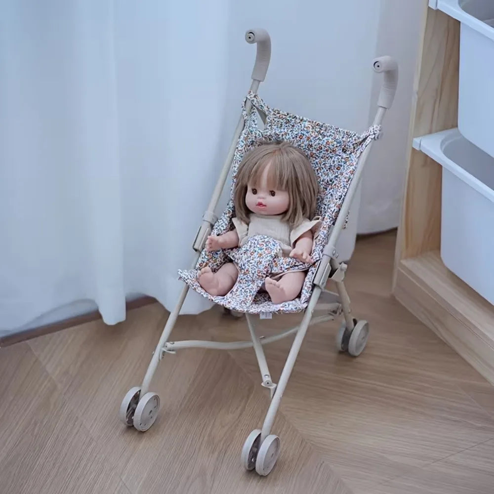 Poussette pliable de haute qualité pour poupée avec motif de fleurs.